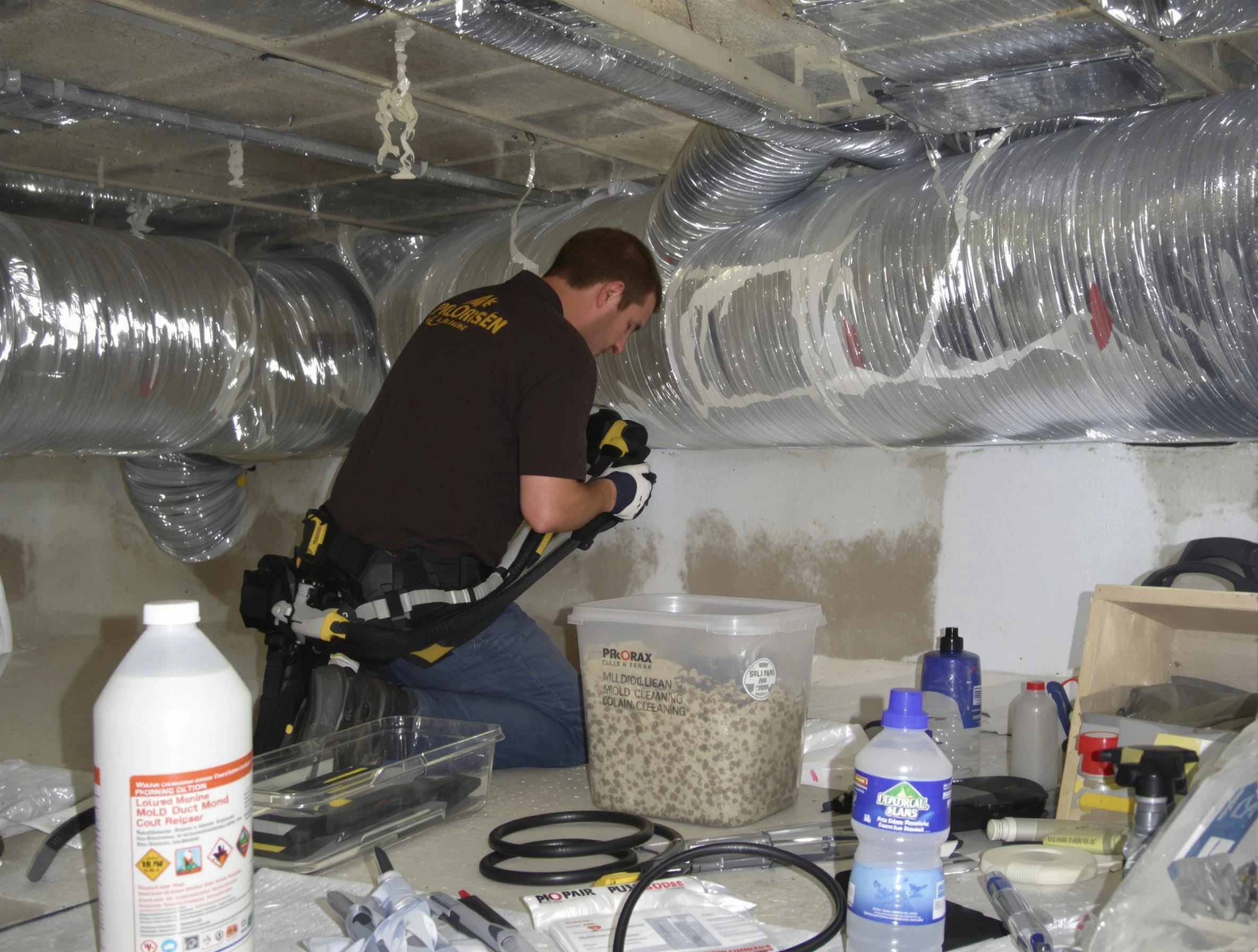 Lowell Air Duct Cleaning specialist performing professional mold removal from air ducts in Lowell